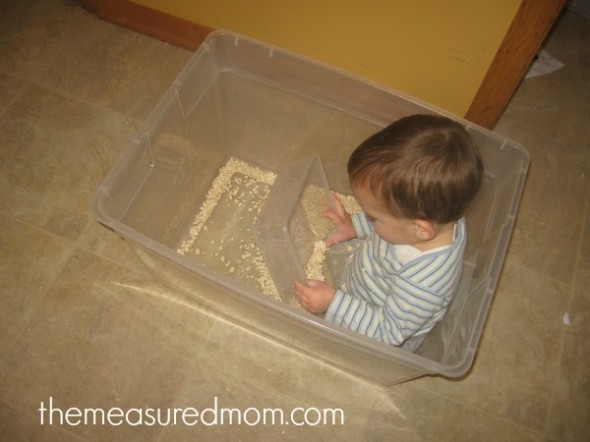 child pouring oats