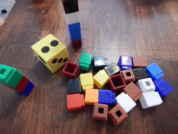 Make measurement a game. Take turns rolling a die and adding that many cubes to your tower. Whose is bigger?